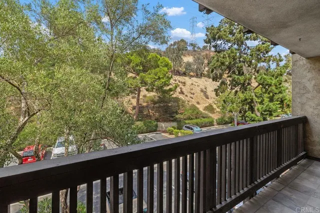 a view of balcony and trees