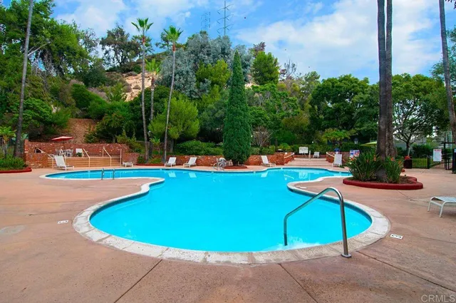 a view of a chairs and table in the patio