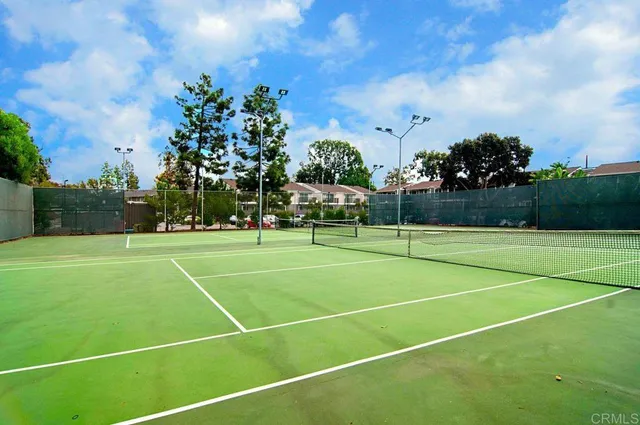 a view of an outdoor space and tennis court