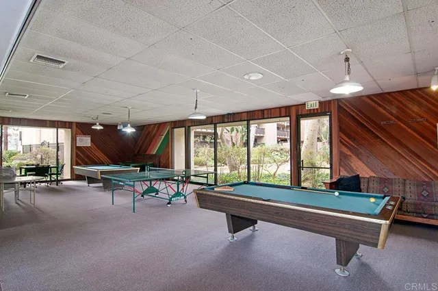 a room with furniture and pool table