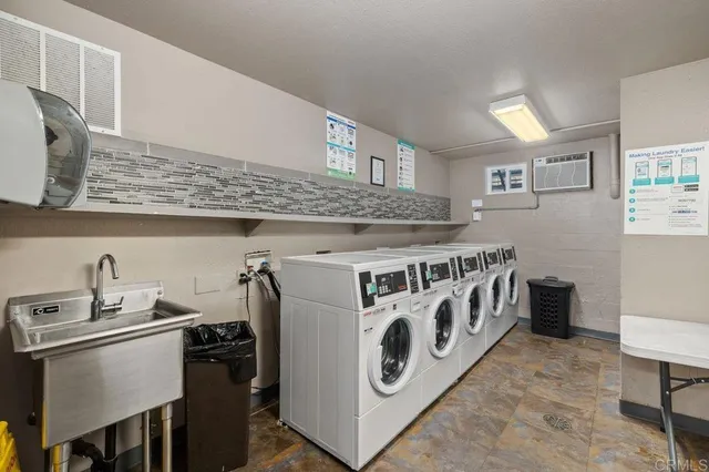 a kitchen with stainless steel appliances granite countertop a stove and a sink