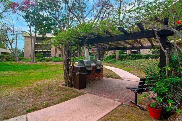 a view of a backyard with sitting area