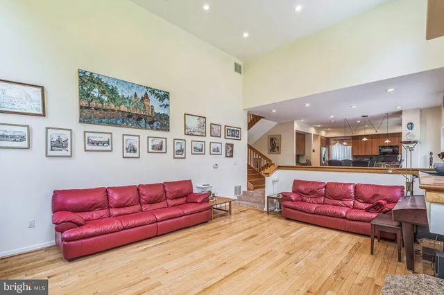 a dining room with furniture and a book shelf