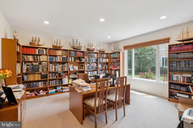 a view of walk in closet with clothes
