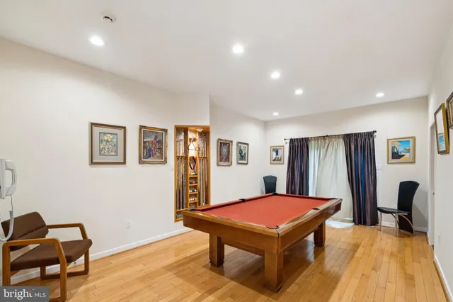 a bathroom with a toilet a sink and a mirror