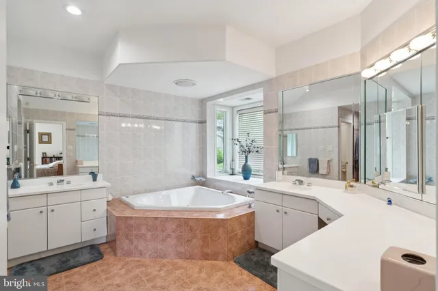 a bathroom with a sink toilet and a mirror