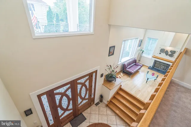 a large kitchen with kitchen island granite countertop a large window and a counter space