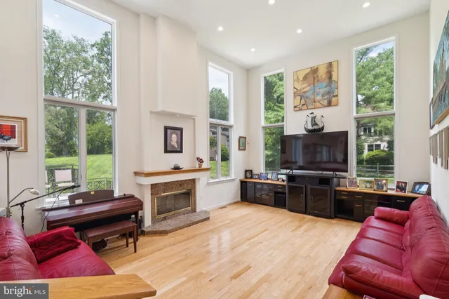 a kitchen with stainless steel appliances granite countertop a sink a refrigerator and a wooden cabinets