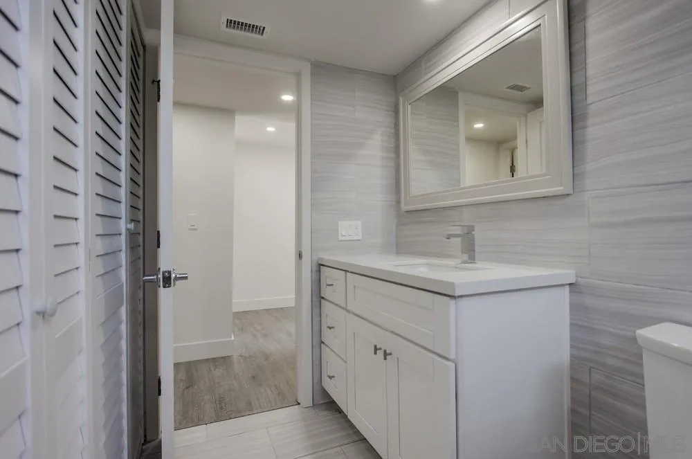 1764 Whitehall Road Encinitas, CA 92024 - Photo 14 of 25 a bathroom with a sink and a mirror