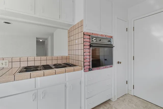 a kitchen with a sink and cabinets