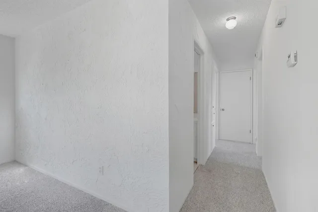 a view of hallway with closet