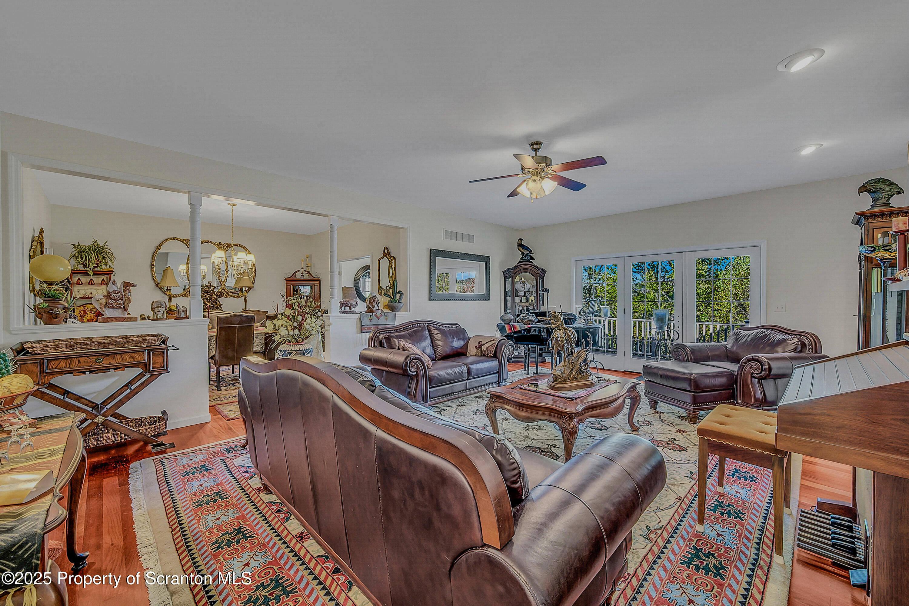 148 Grandview Drive Tunkhannock, PA 18657 - Photo 15 of 41 a living room with furniture a flat screen tv and a large window