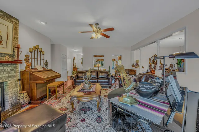 a living room with lots of furniture and gym equipment