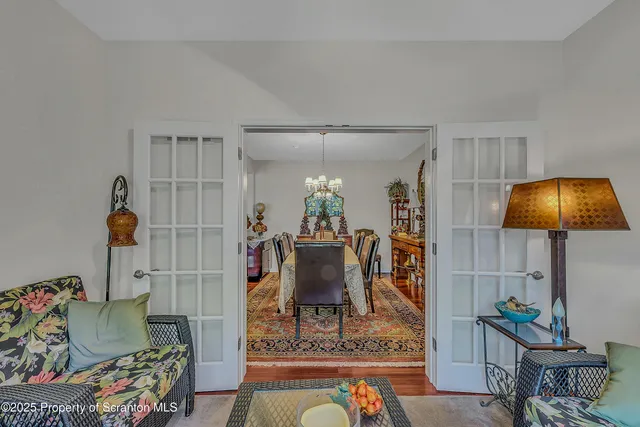a living room with furniture and a lamp