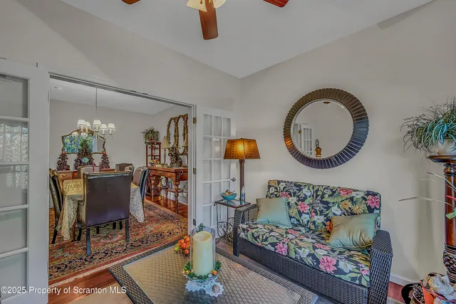 an outdoor living room with furniture and a mirror