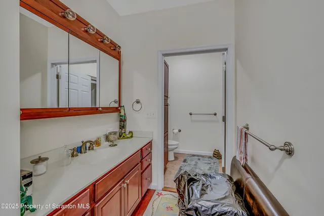 a bathroom with a sink mirror and a bathtub