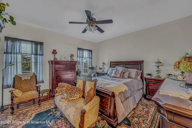 a bedroom with furniture and a window