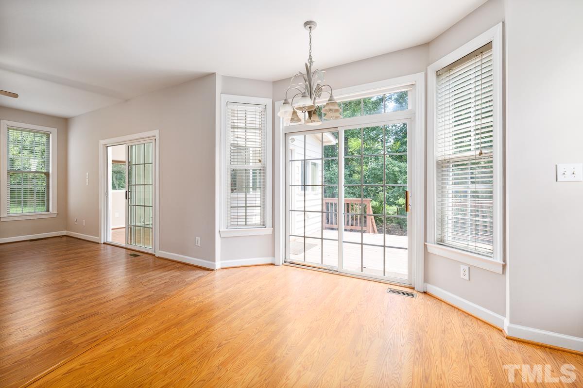 3308 Heygill Lane Raleigh, NC 27604 - Photo 11 of 18 a view of an empty room with wooden floor and a window