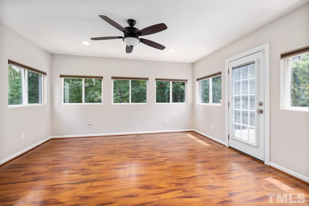 3308 Heygill Lane Raleigh, NC 27604 - Photo 12 of 18 a view of an empty room with wooden floor and a window