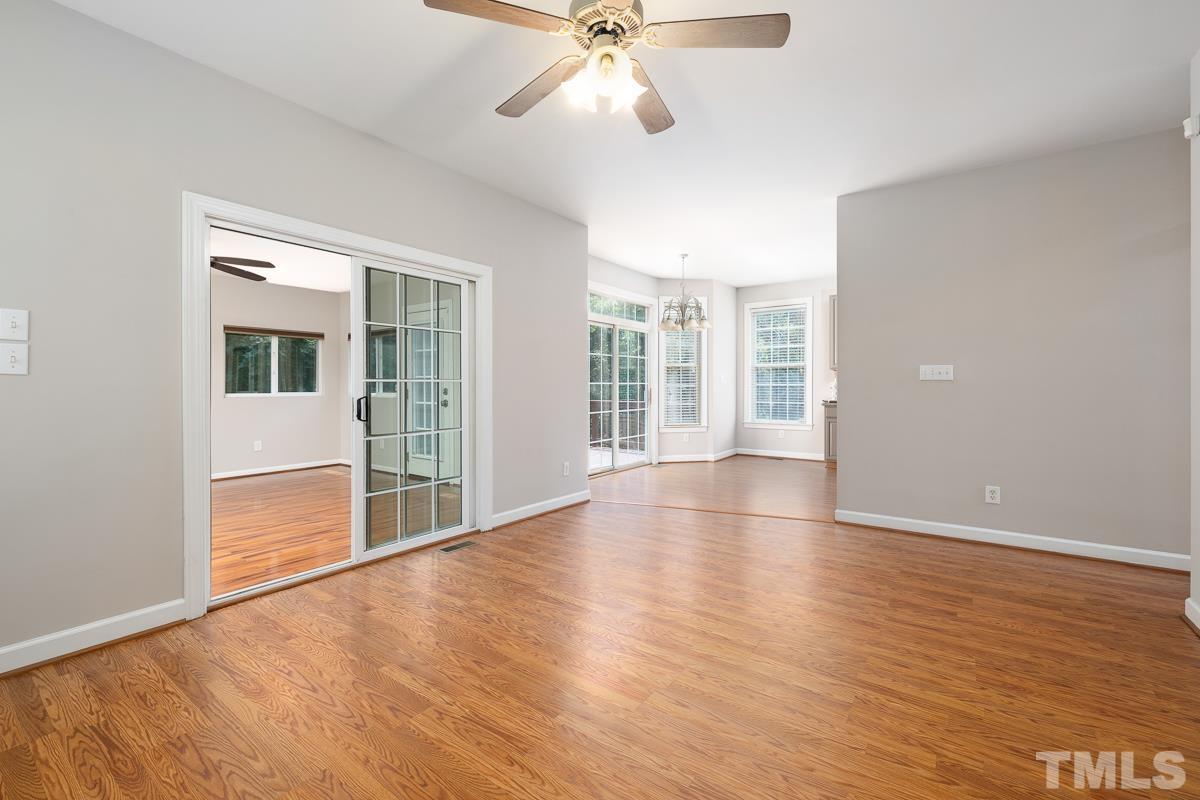 3308 Heygill Lane Raleigh, NC 27604 - Photo 13 of 18 an empty room with wooden floor and windows