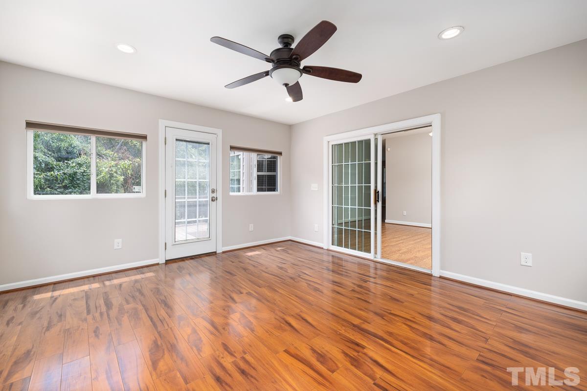 3308 Heygill Lane Raleigh, NC 27604 - Photo 15 of 18 a view of an empty room with a window and wooden floor