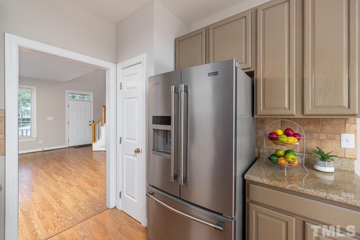 3308 Heygill Lane Raleigh, NC 27604 - Photo 18 of 18 a kitchen with stainless steel appliances granite countertop a refrigerator and a stove