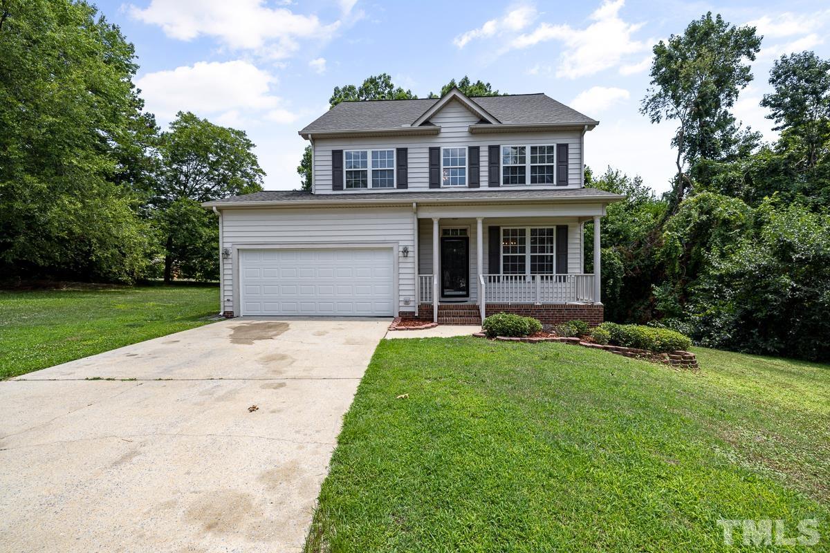 3308 Heygill Lane Raleigh, NC 27604 - Photo 2 of 18 a front view of a house with a yard and garage