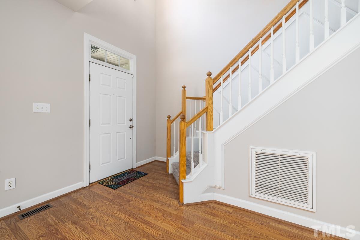 3308 Heygill Lane Raleigh, NC 27604 - Photo 6 of 18 a view of entryway and hall with wooden floor