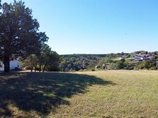 a view of a houses with a lake view