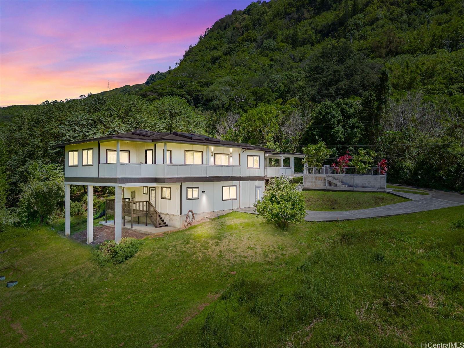 a view of sign board with tall buildings