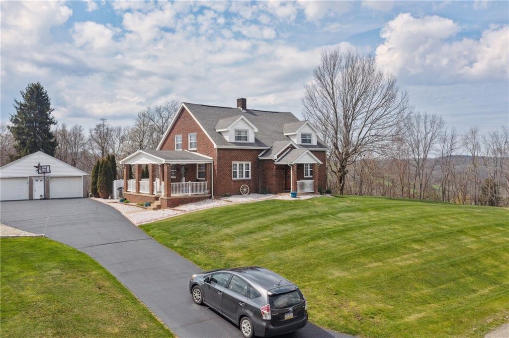 587 McKee Road Washington, PA 15301 - Photo 2 of 38 a front view of a house with garden
