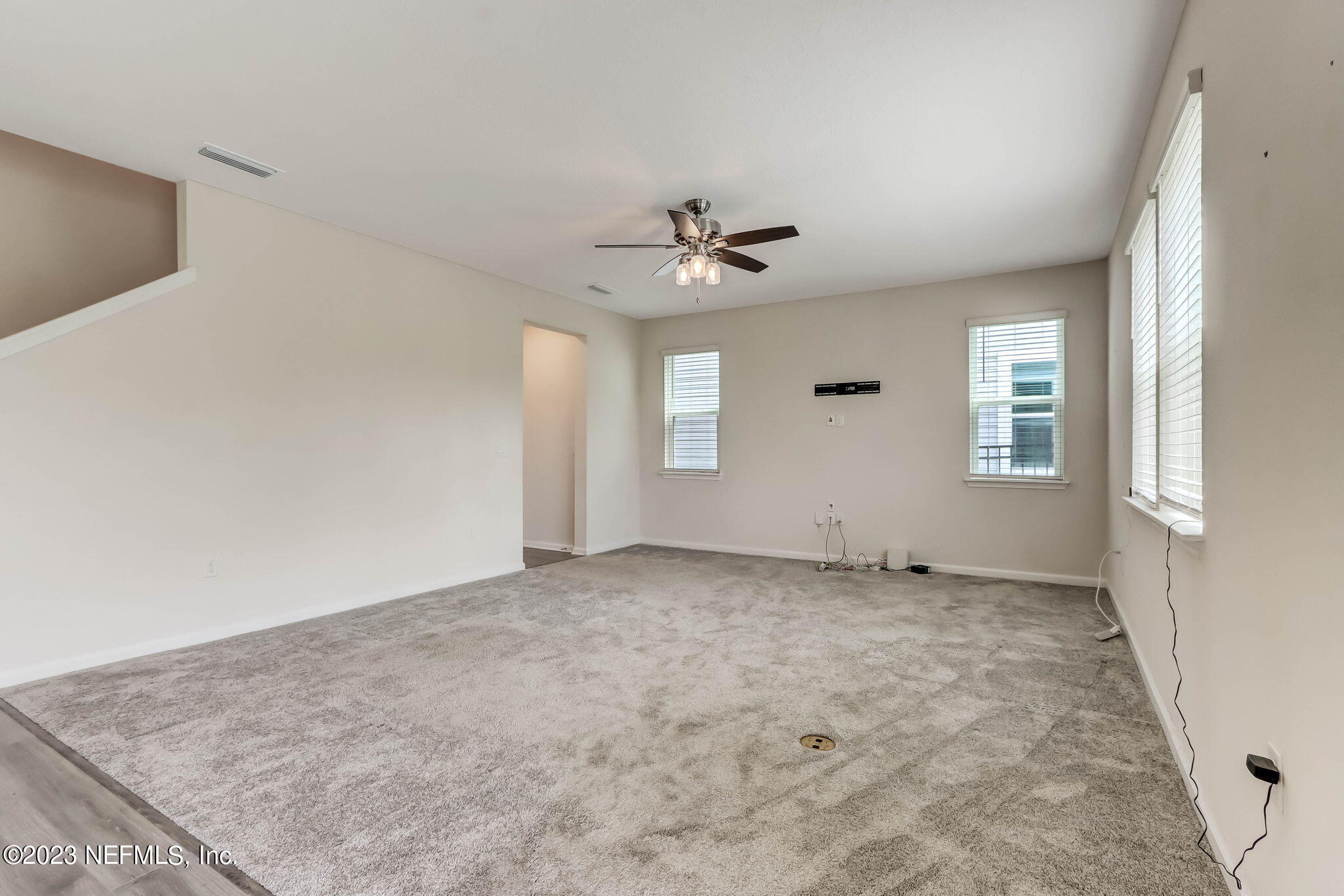 75944 Saffron Lane Yulee, FL 32097 - Photo 16 of 79 an empty room with windows and fan