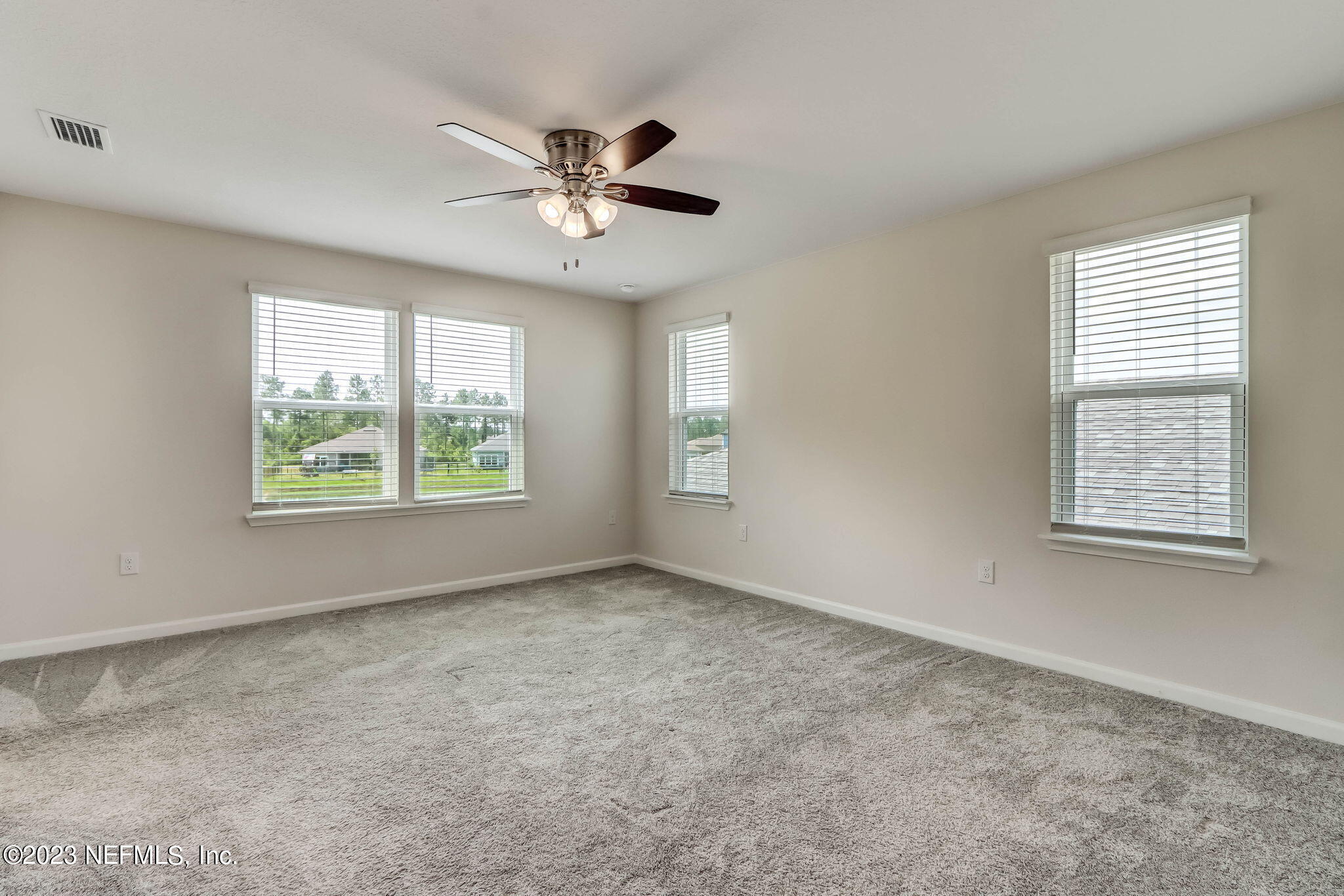 75944 Saffron Lane Yulee, FL 32097 - Photo 21 of 79 a view of an empty room with a window