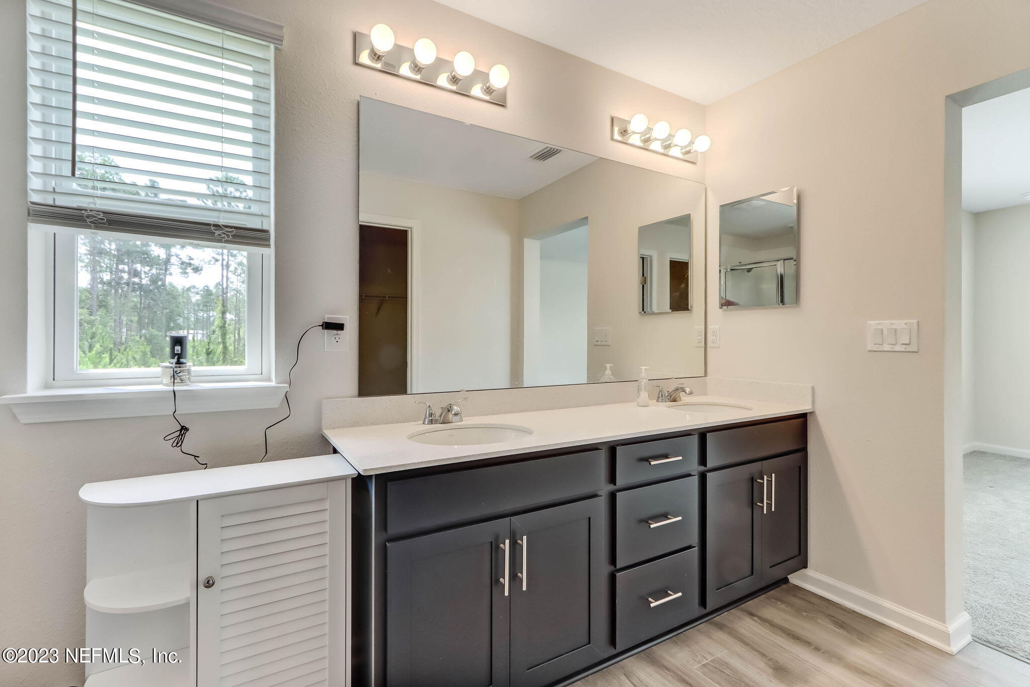 75944 Saffron Lane Yulee, FL 32097 - Photo 24 of 79 a bathroom with a sink double vanity and a mirror