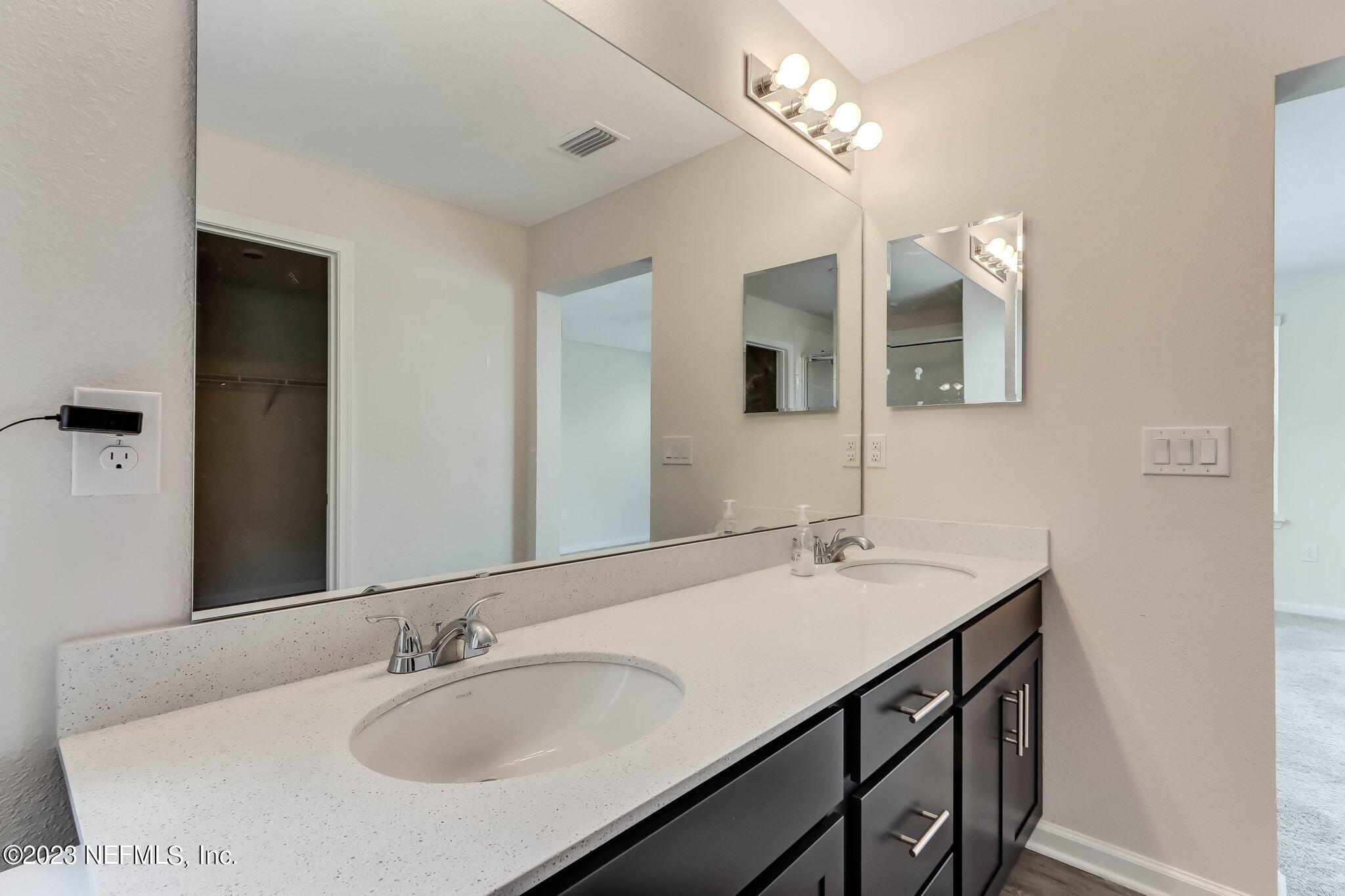 75944 Saffron Lane Yulee, FL 32097 - Photo 25 of 79 a bathroom with a sink and a mirror