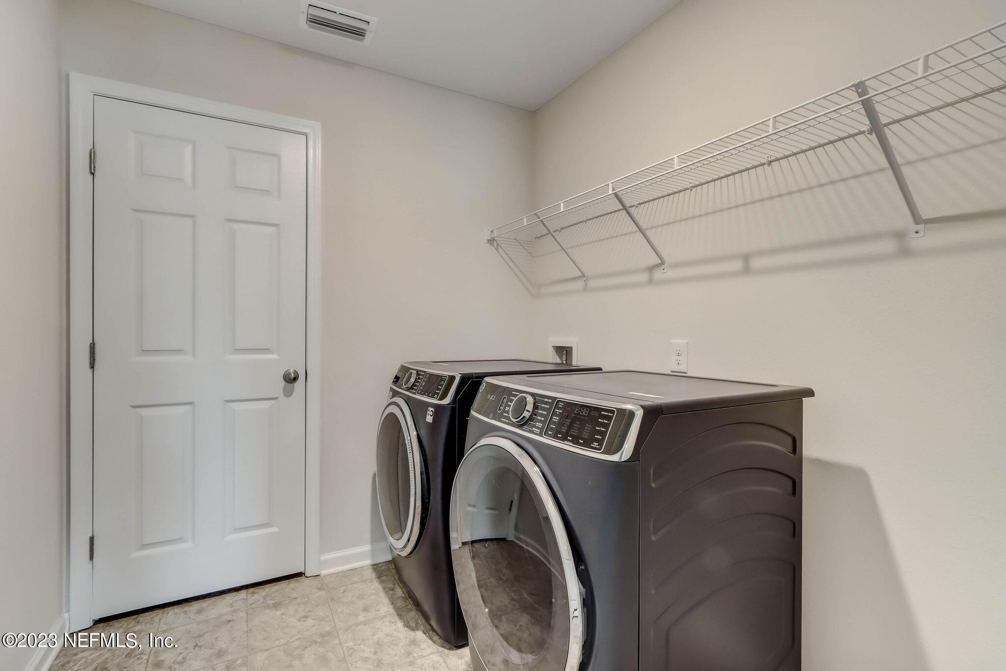 75944 Saffron Lane Yulee, FL 32097 - Photo 35 of 79 a utility room with dryer and washer