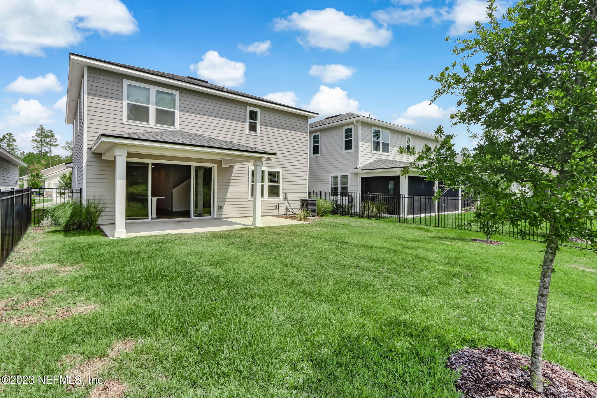 75944 Saffron Lane Yulee, FL 32097 - Photo 36 of 79 a front view of a house with a garden