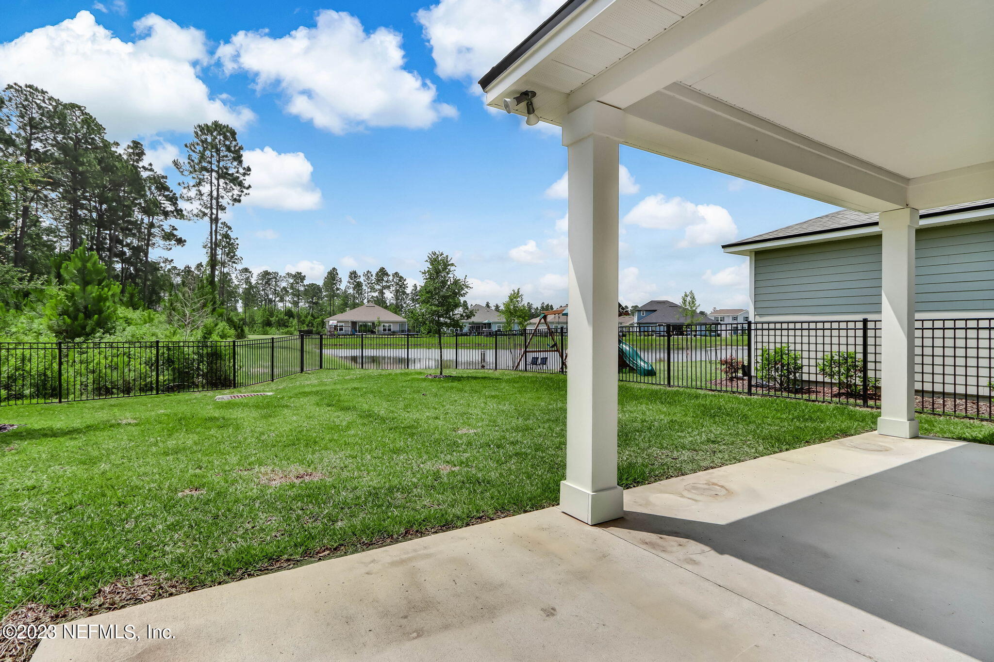 75944 Saffron Lane Yulee, FL 32097 - Photo 38 of 79 a view of a porch with a big yard