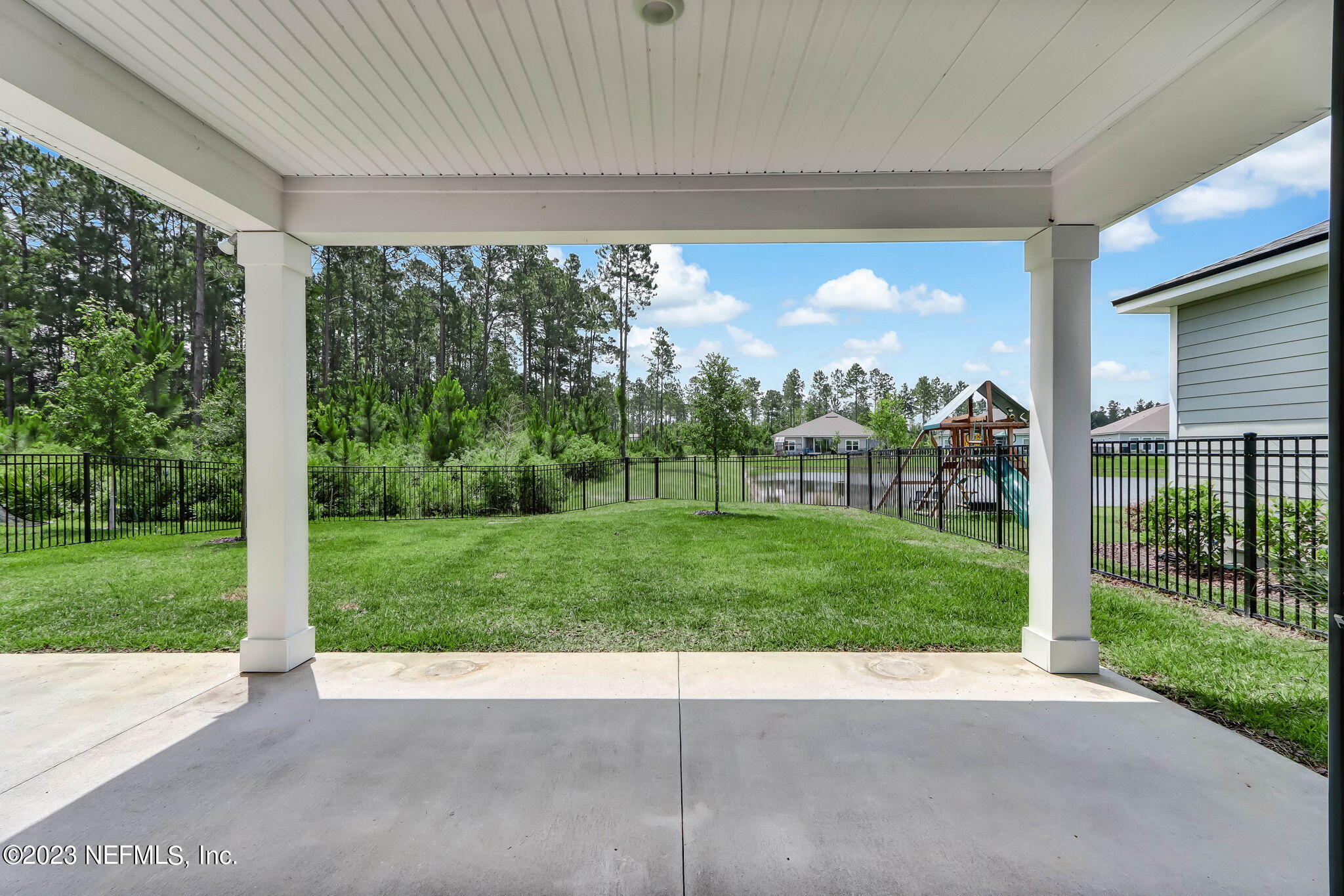 75944 Saffron Lane Yulee, FL 32097 - Photo 40 of 79 a view of a porch with a yard