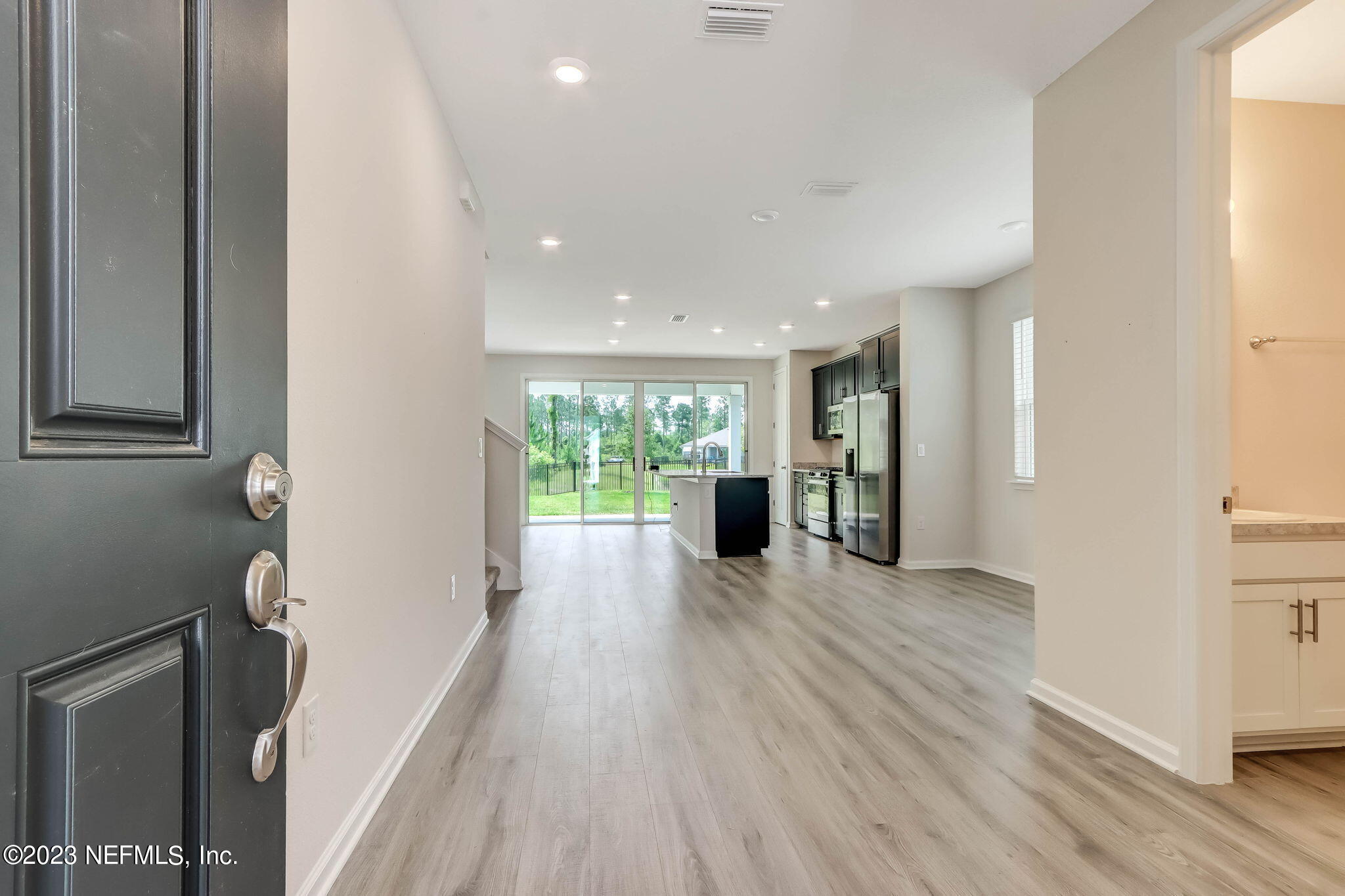 75944 Saffron Lane Yulee, FL 32097 - Photo 4 of 79 a view of a big room with wooden floor and windows