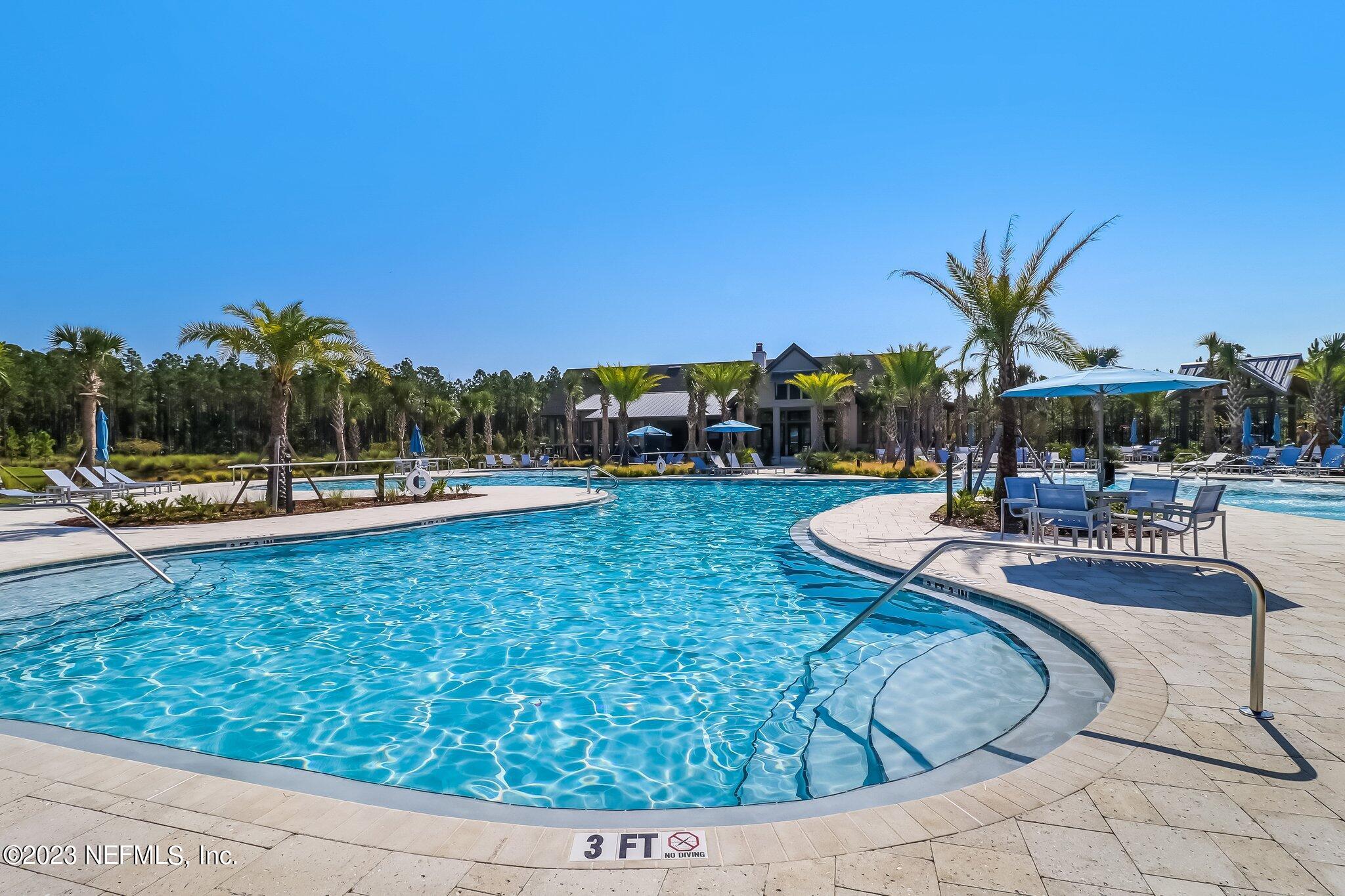 75944 Saffron Lane Yulee, FL 32097 - Photo 53 of 79 a view of a swimming pool with outdoor seating