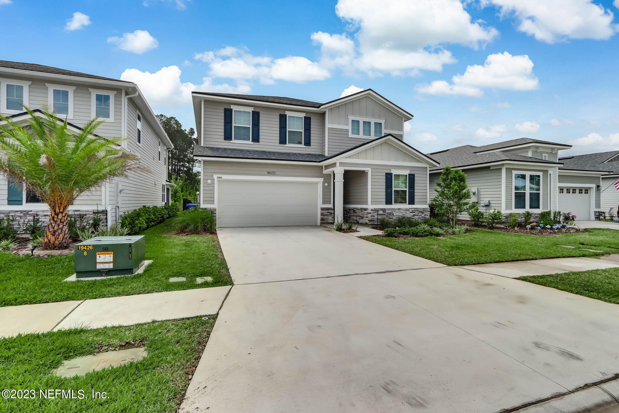 75944 Saffron Lane Yulee, FL 32097 - Photo 79 of 79 a front view of a house with a yard