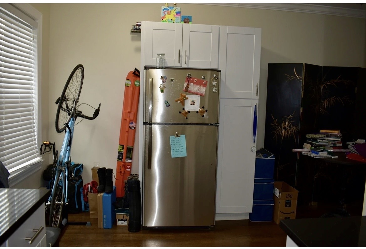 3817 North Greenview Avenue, Unit 3W Chicago, IL 60613 - Photo 6 of 10 a kitchen with a refrigerator and white cabinets