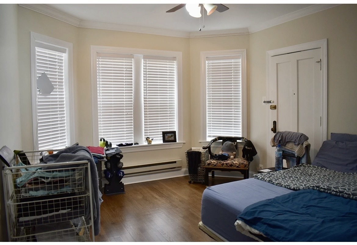 3817 North Greenview Avenue, Unit 3W Chicago, IL 60613 - Photo 8 of 10 a bedroom with two beds and windows