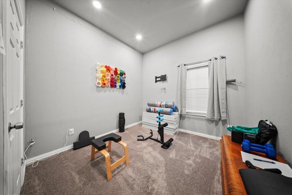 5312 Black Hawk Street Dallas, TX 75212 - Photo 16 of 24 a living room with furniture and a rug