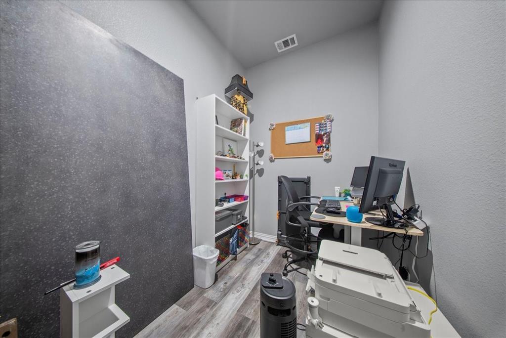 5312 Black Hawk Street Dallas, TX 75212 - Photo 17 of 24 a work room with furniture and wooden floor