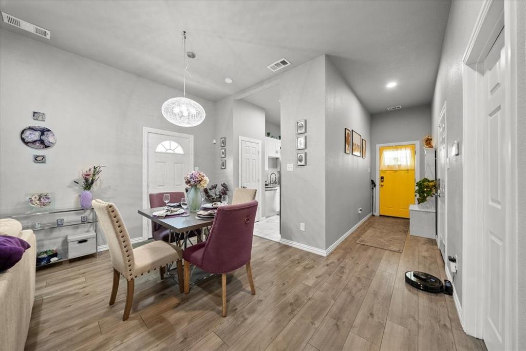 5312 Black Hawk Street Dallas, TX 75212 - Photo 19 of 24 a view of a dining room with furniture and wooden floor
