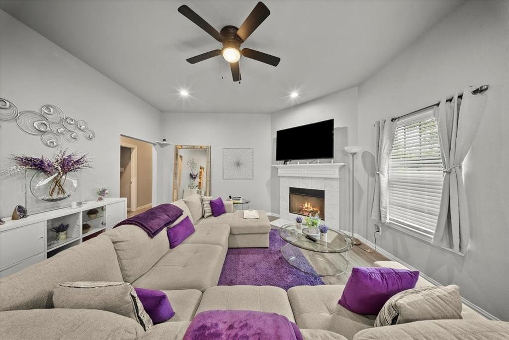 5312 Black Hawk Street Dallas, TX 75212 - Photo 2 of 24 a living room with furniture fireplace and a flat screen tv