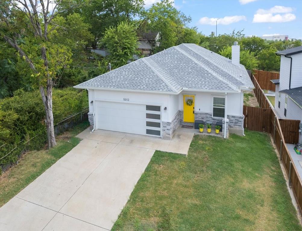 5312 Black Hawk Street Dallas, TX 75212 - Photo 5 of 24 a view of a house with backyard and porch