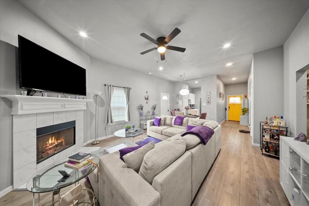 5312 Black Hawk Street Dallas, TX 75212 - Photo 7 of 24 a living room with furniture fireplace and flat screen tv